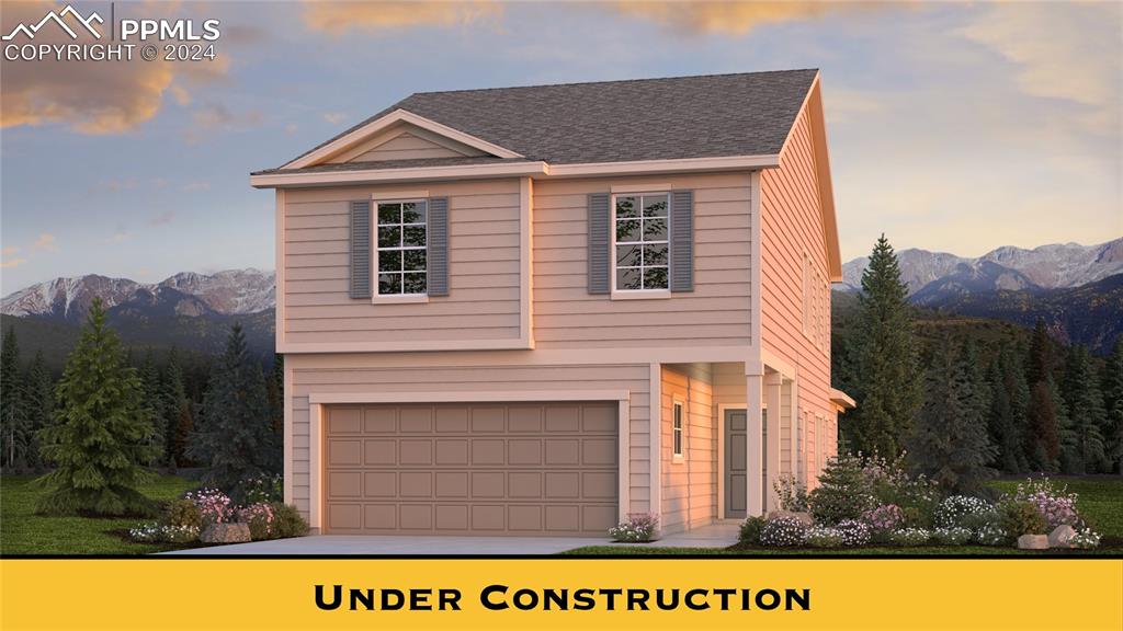 Front facade featuring a mountain view and a garage