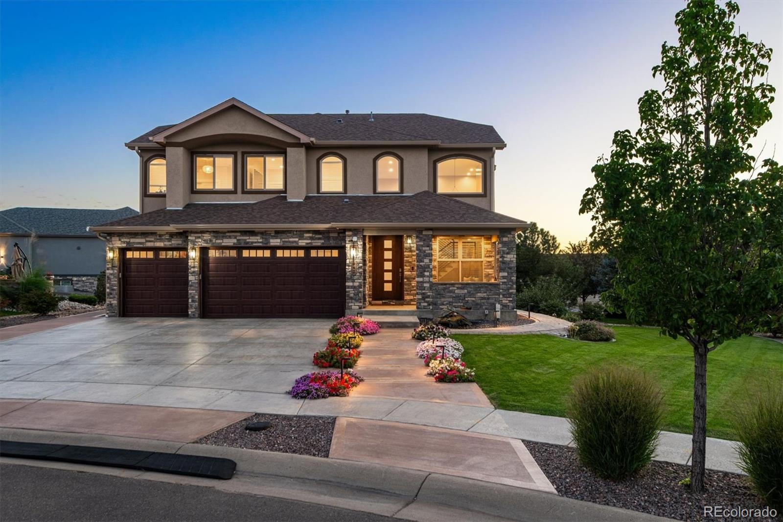 a front view of a house with yard