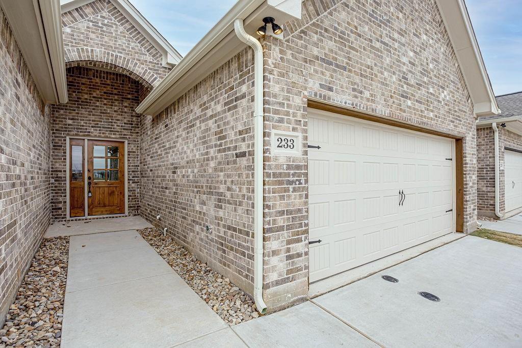 a view of a brick house with an empty space