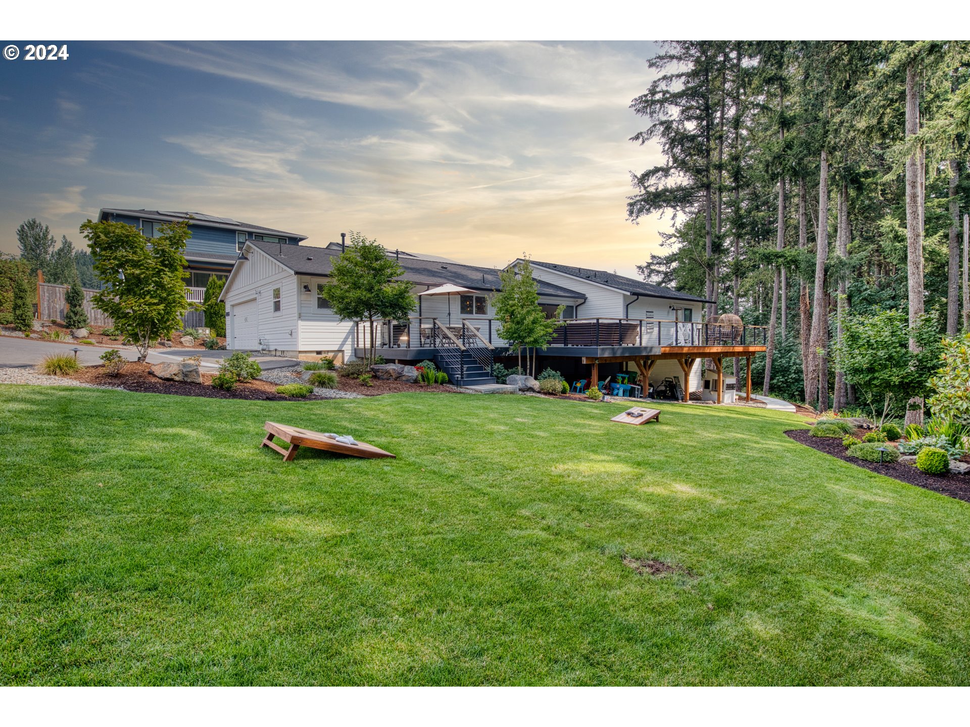 a view of an house with backyard space and swimming pool