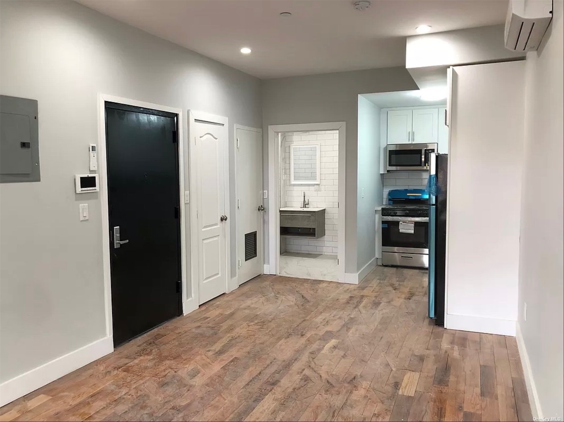 a view of kitchen and refrigerator