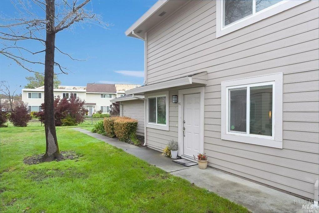 a view of a house with a backyard