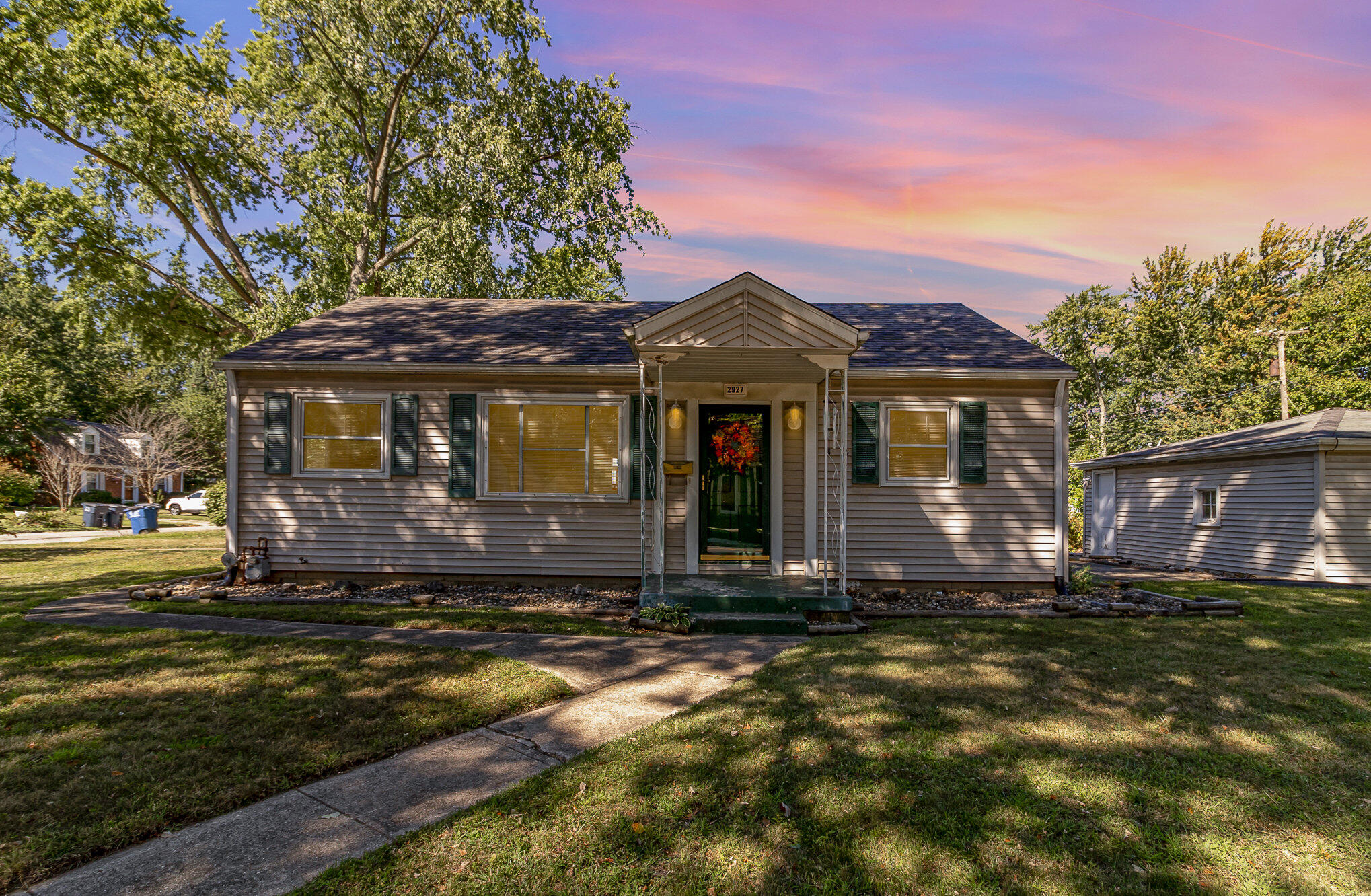 a front view of a house with a yard