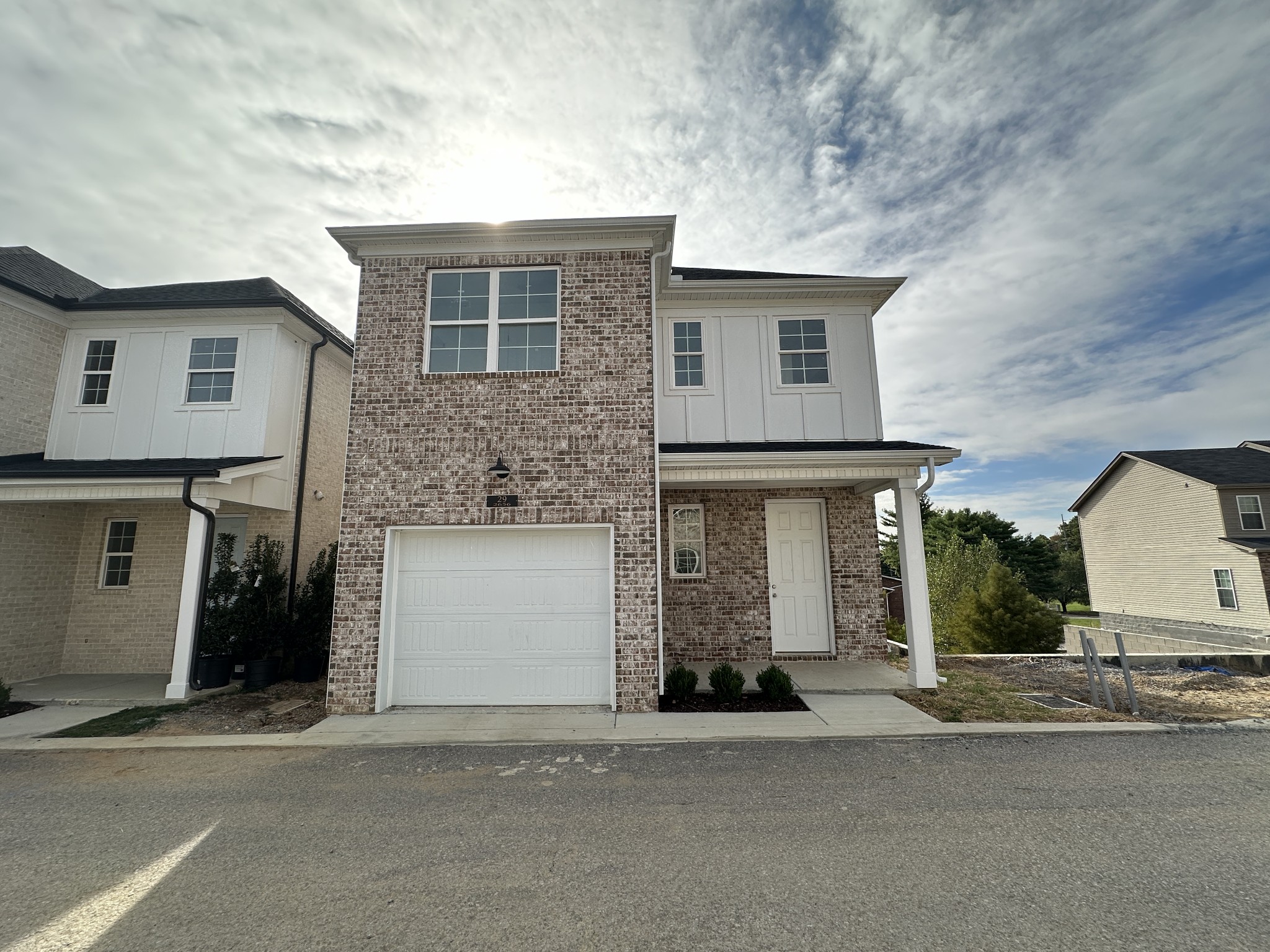 a front view of a house with a garage