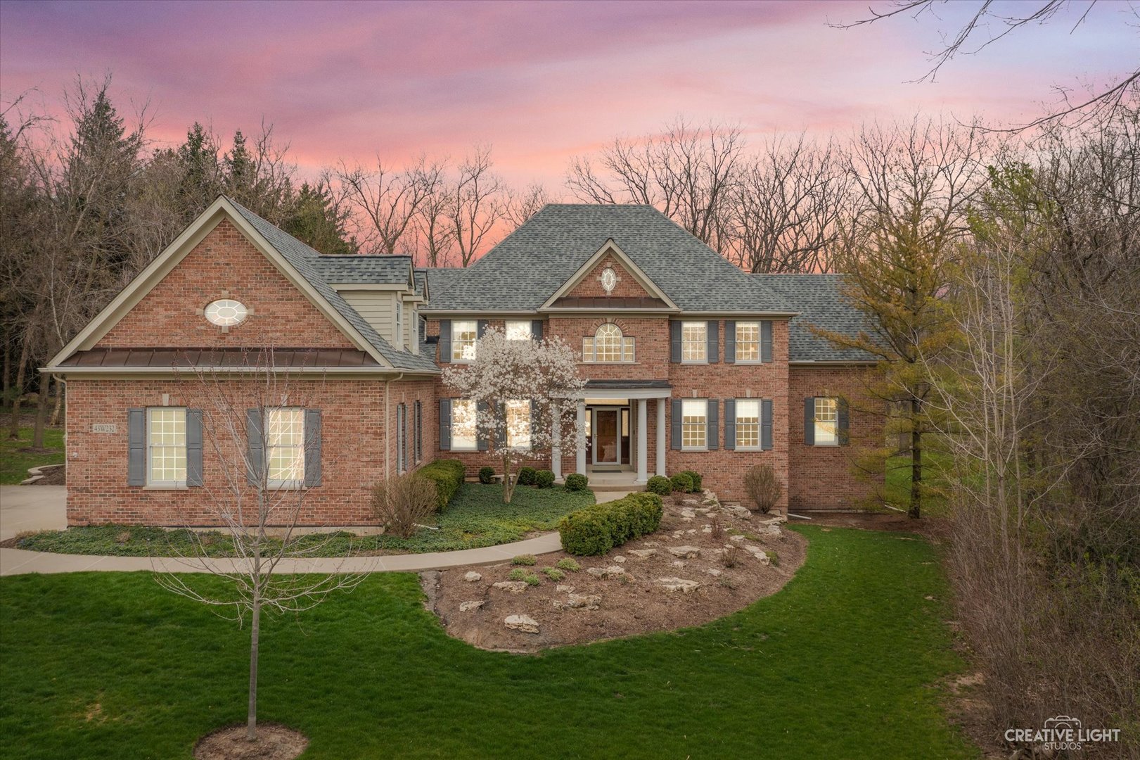 a front view of a house with a yard