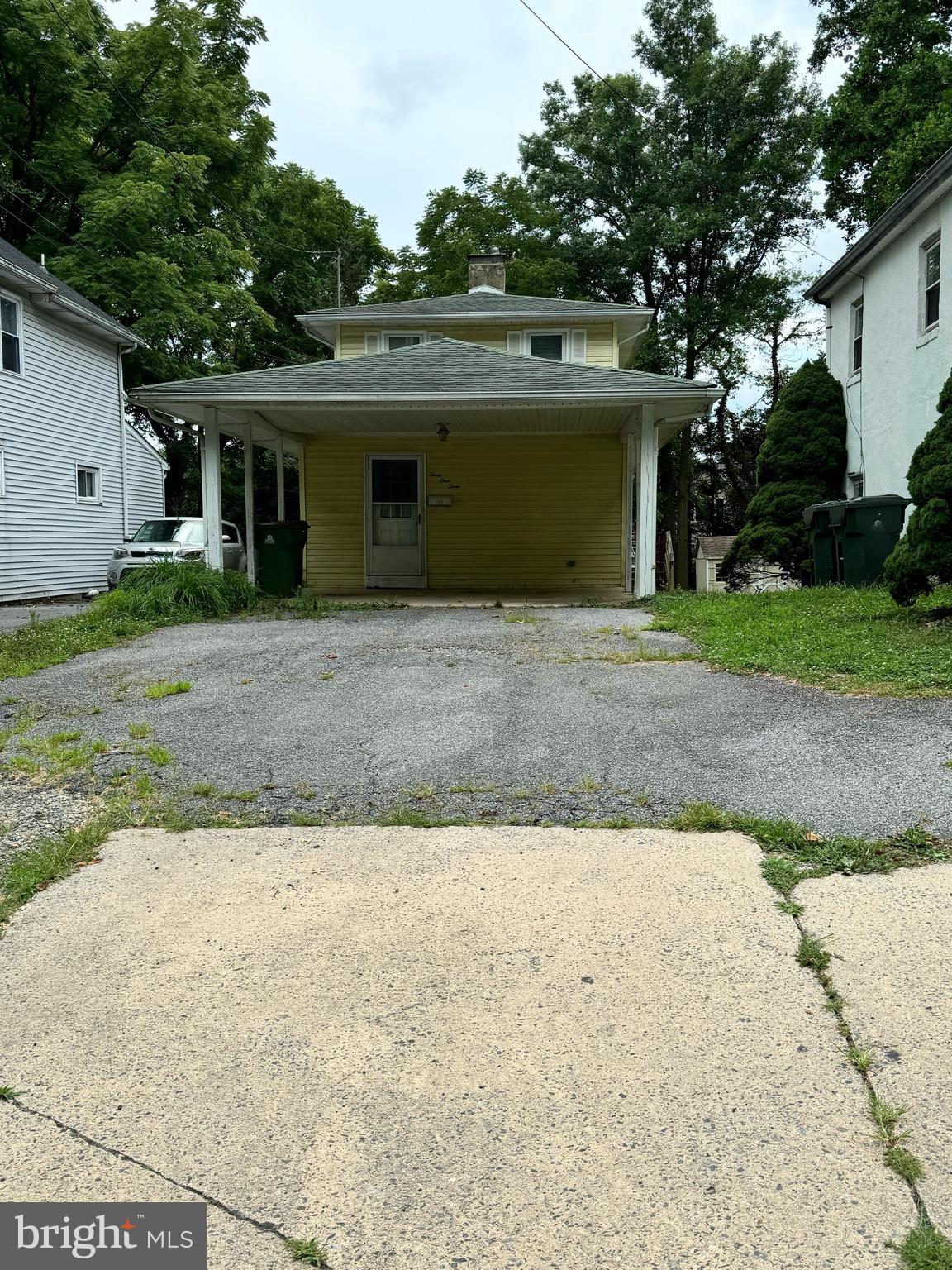 a front view of a house with a yard and a garage