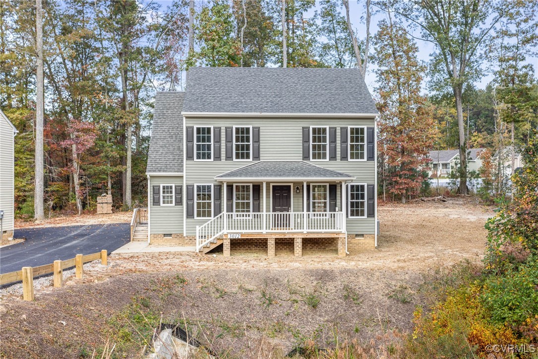 front view of a house with a yard