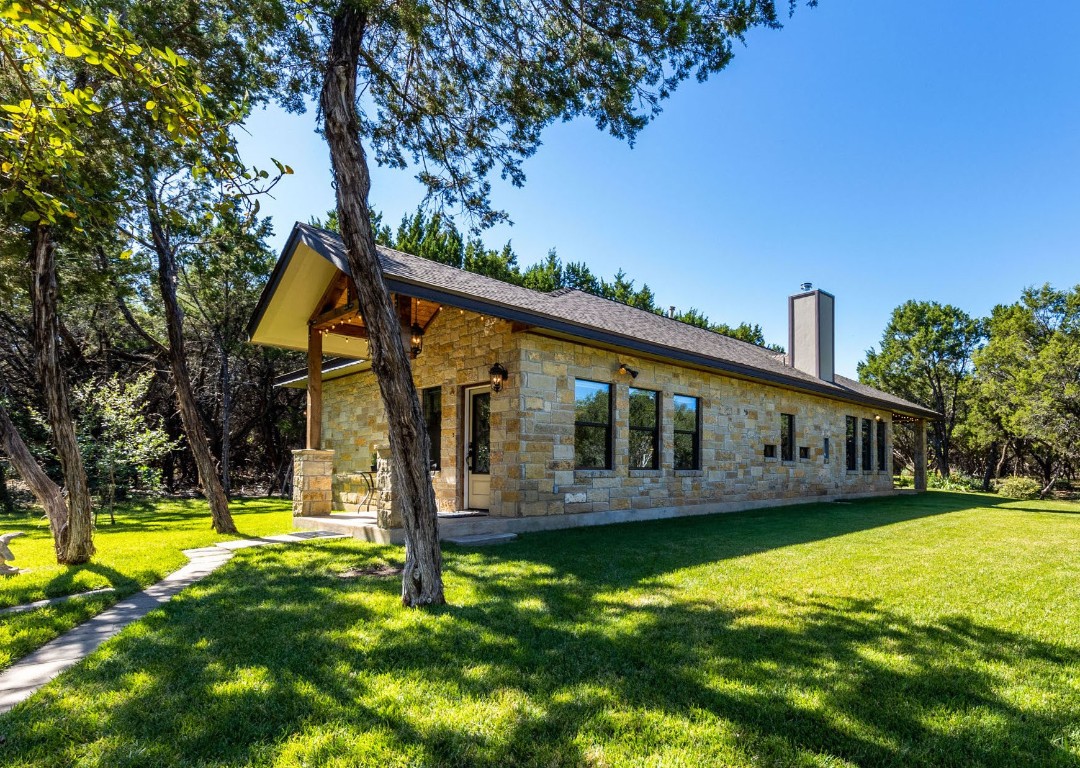 a view of a house with swimming pool and porch