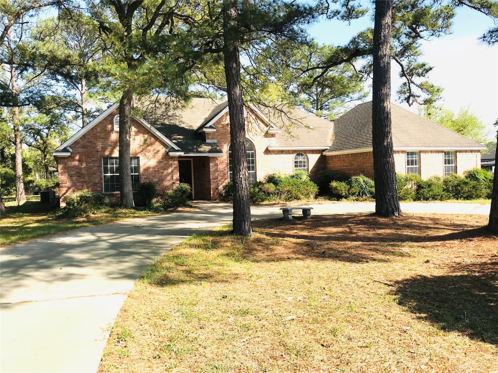 a view of a house with a tree in the background