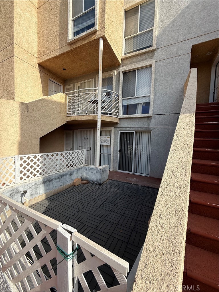 a view of a backyard with sitting area