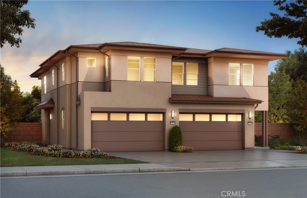 a front view of a house with garage