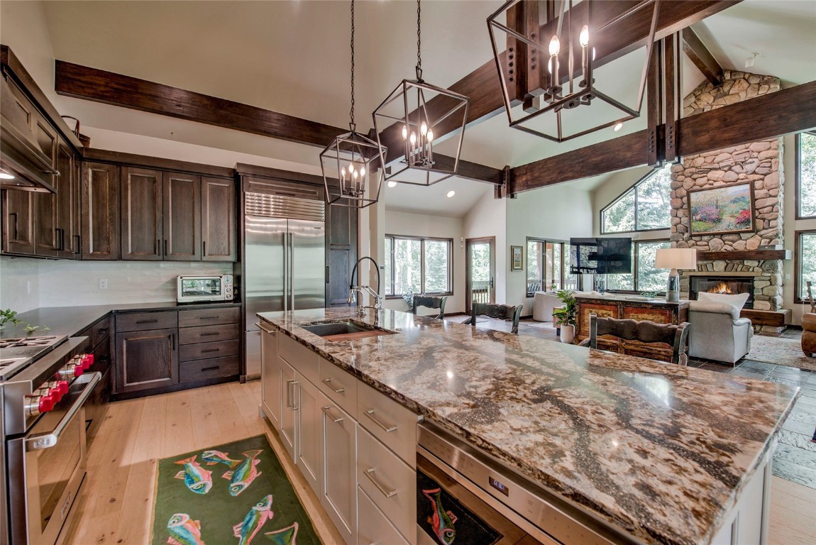 a kitchen with lots of counter top space appliances and cabinets