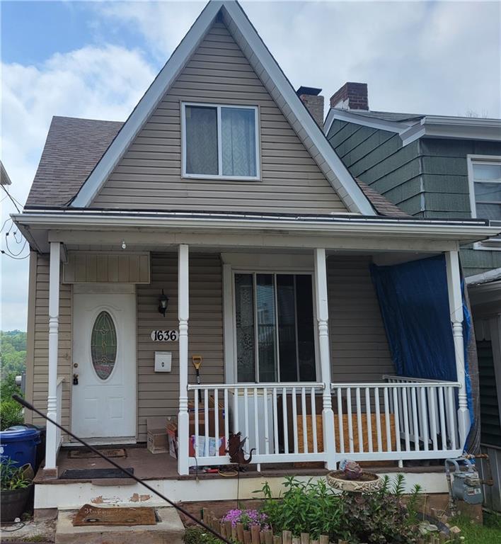 a view of a house with wooden deck