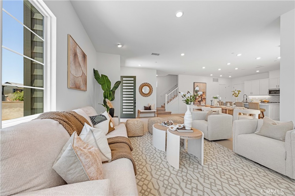 a living room with furniture and a table