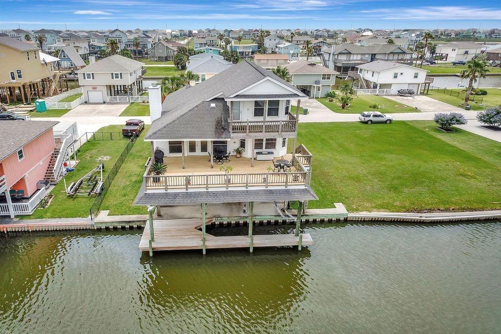 an aerial view of a house with a ocean view