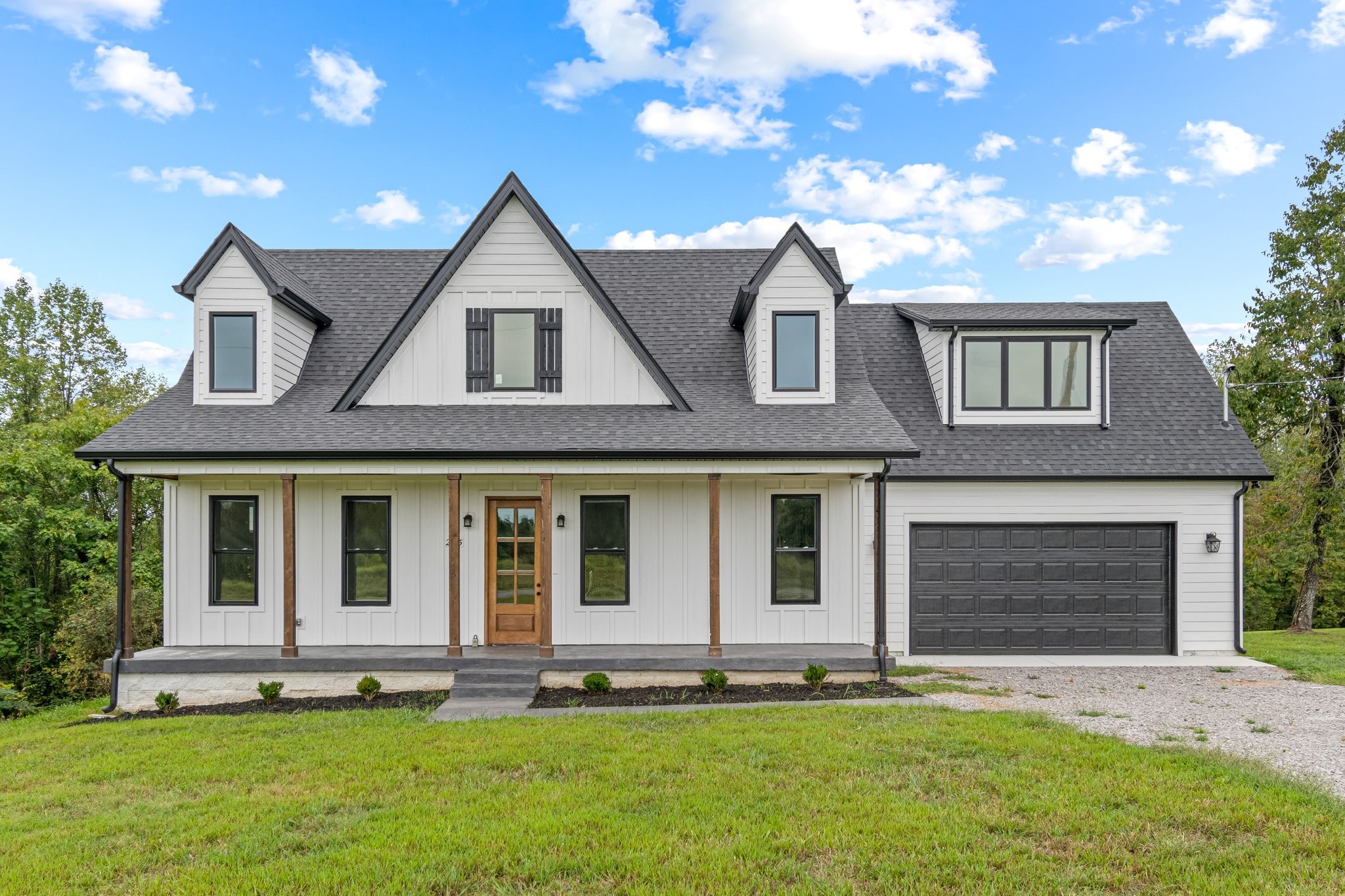 front view of a house with a yard