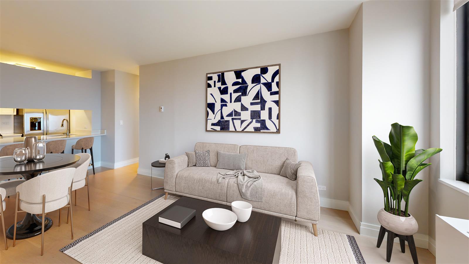 a living room with furniture and a potted plant