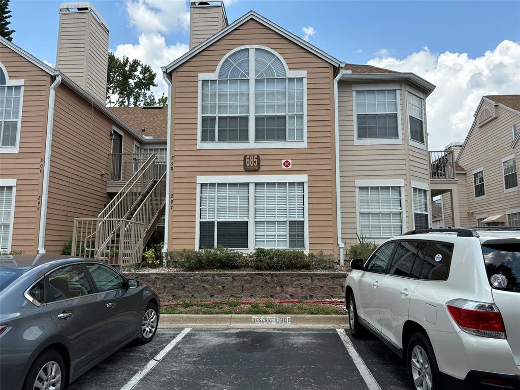 a front view of a house with parking space