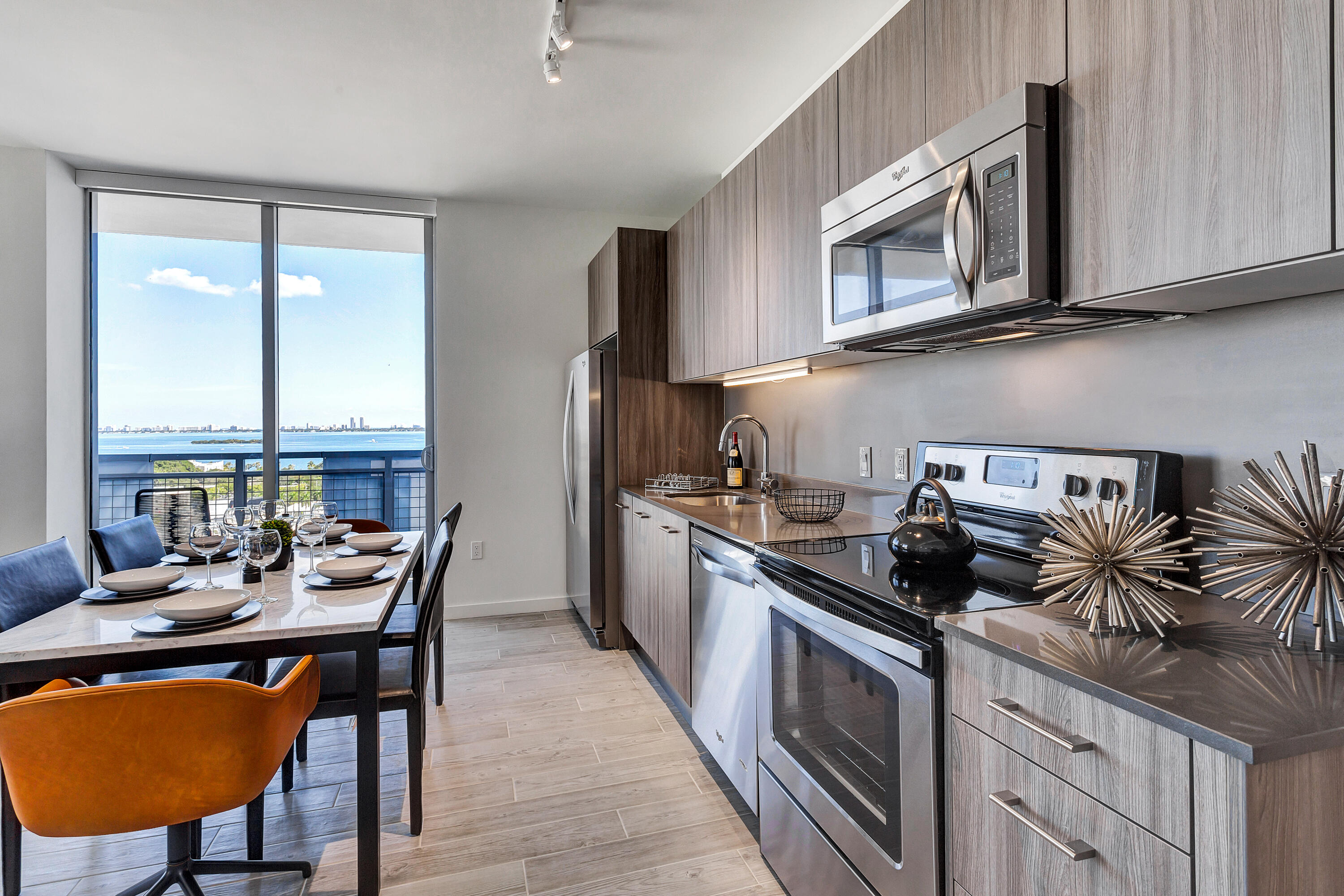 a kitchen with a stove a sink and a microwave