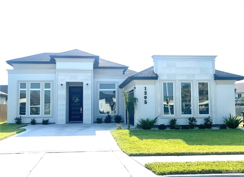 front view of a house with a yard