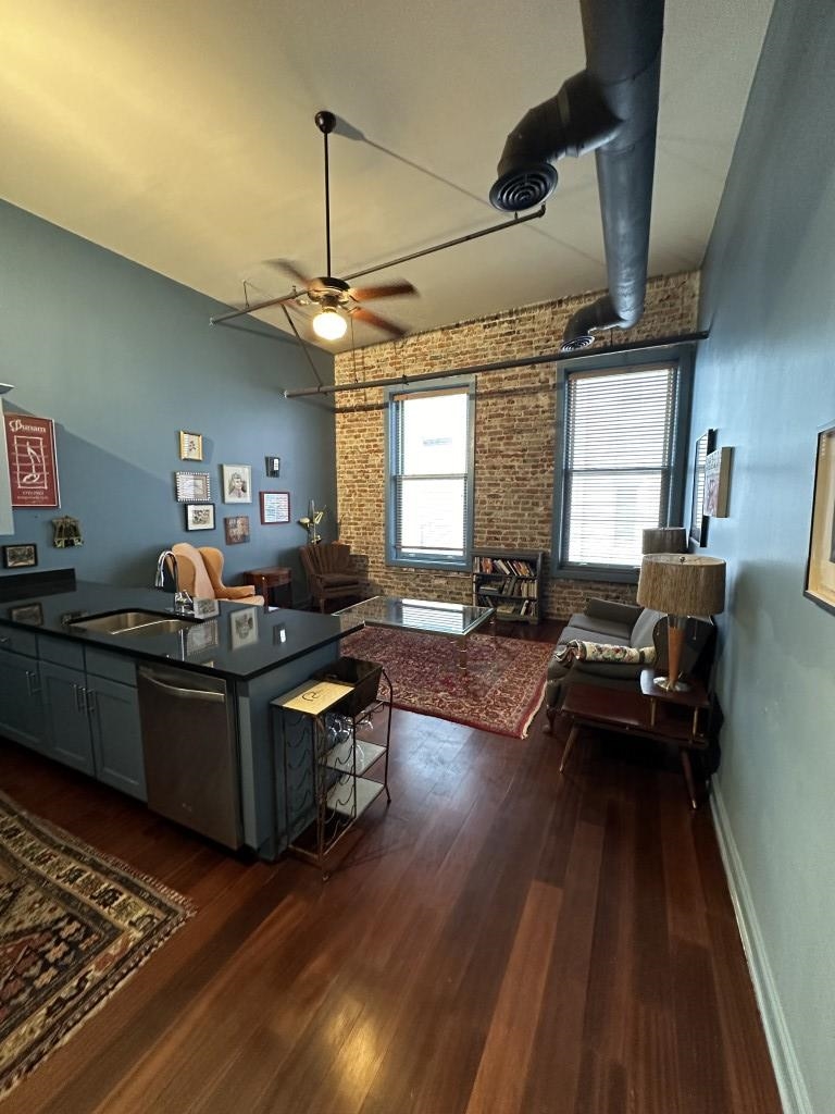 a living room with furniture windows and a fireplace