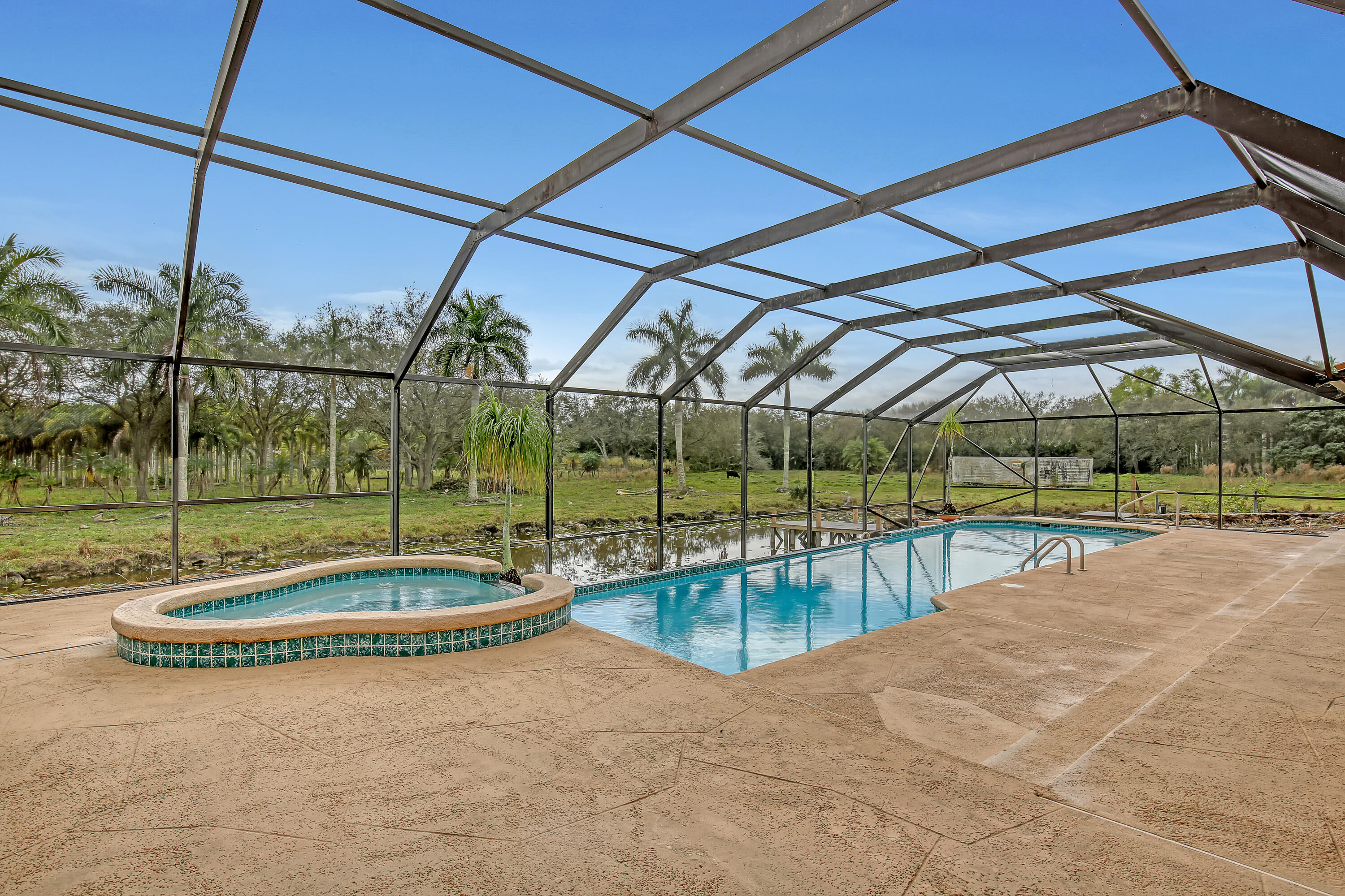 a view of a swimming pool with a yard