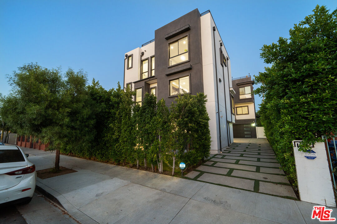 a front view of a house with outdoor space