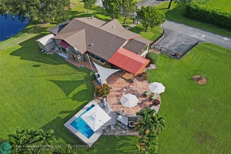 an aerial view of a house with a garden