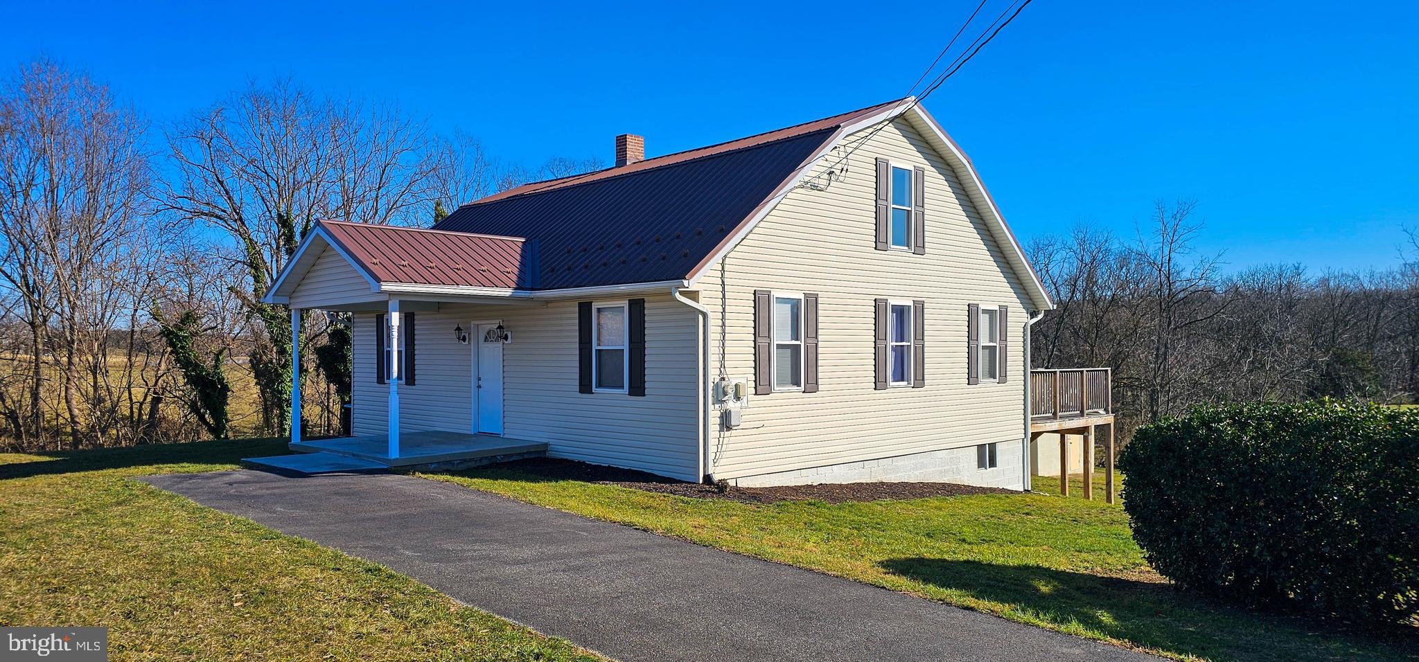 a view of house with yard