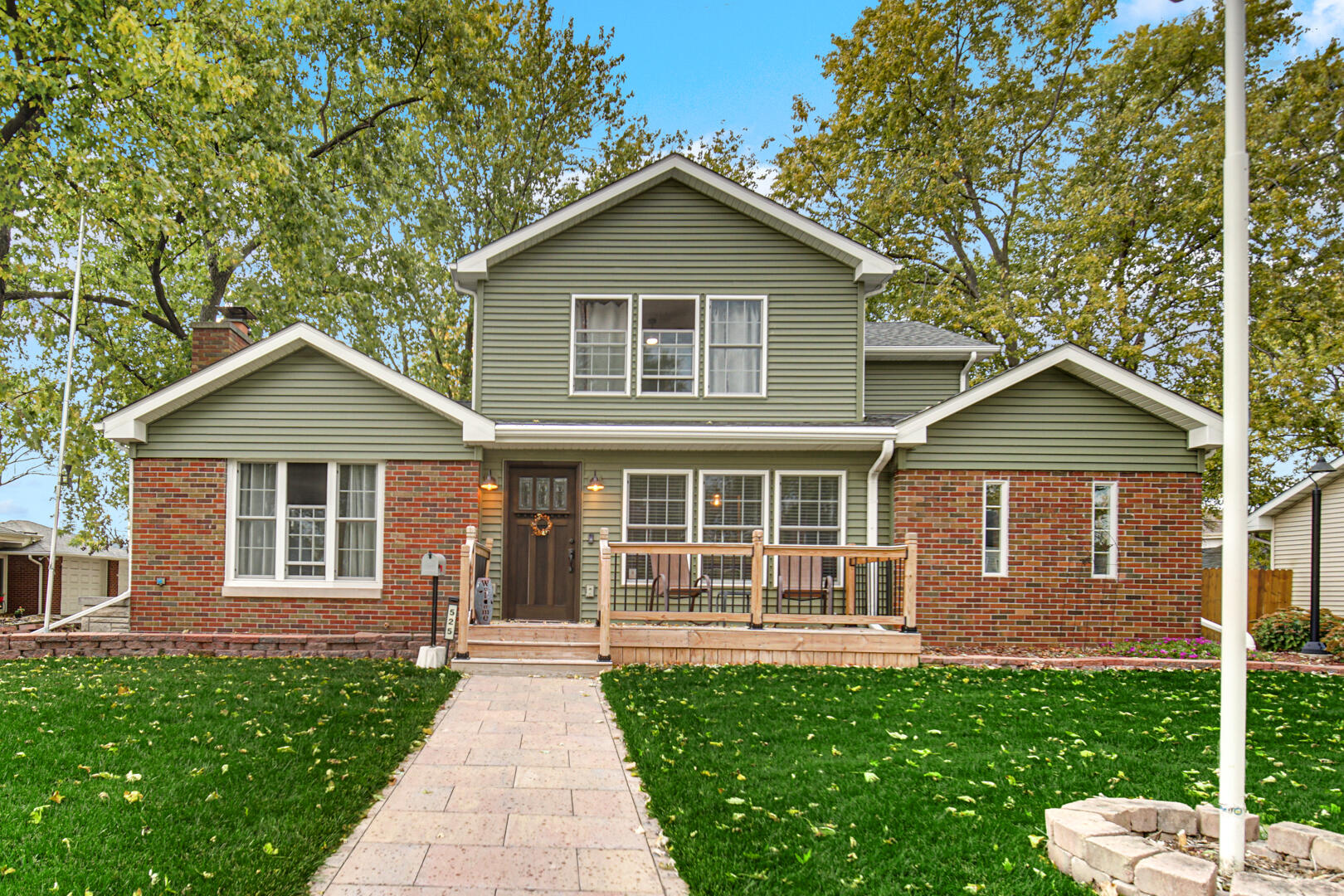 a front view of a house with yard