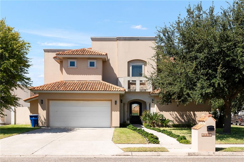 a front view of a house with a garage