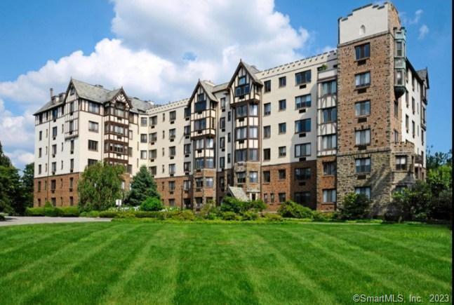 a large building with a yard in front of it