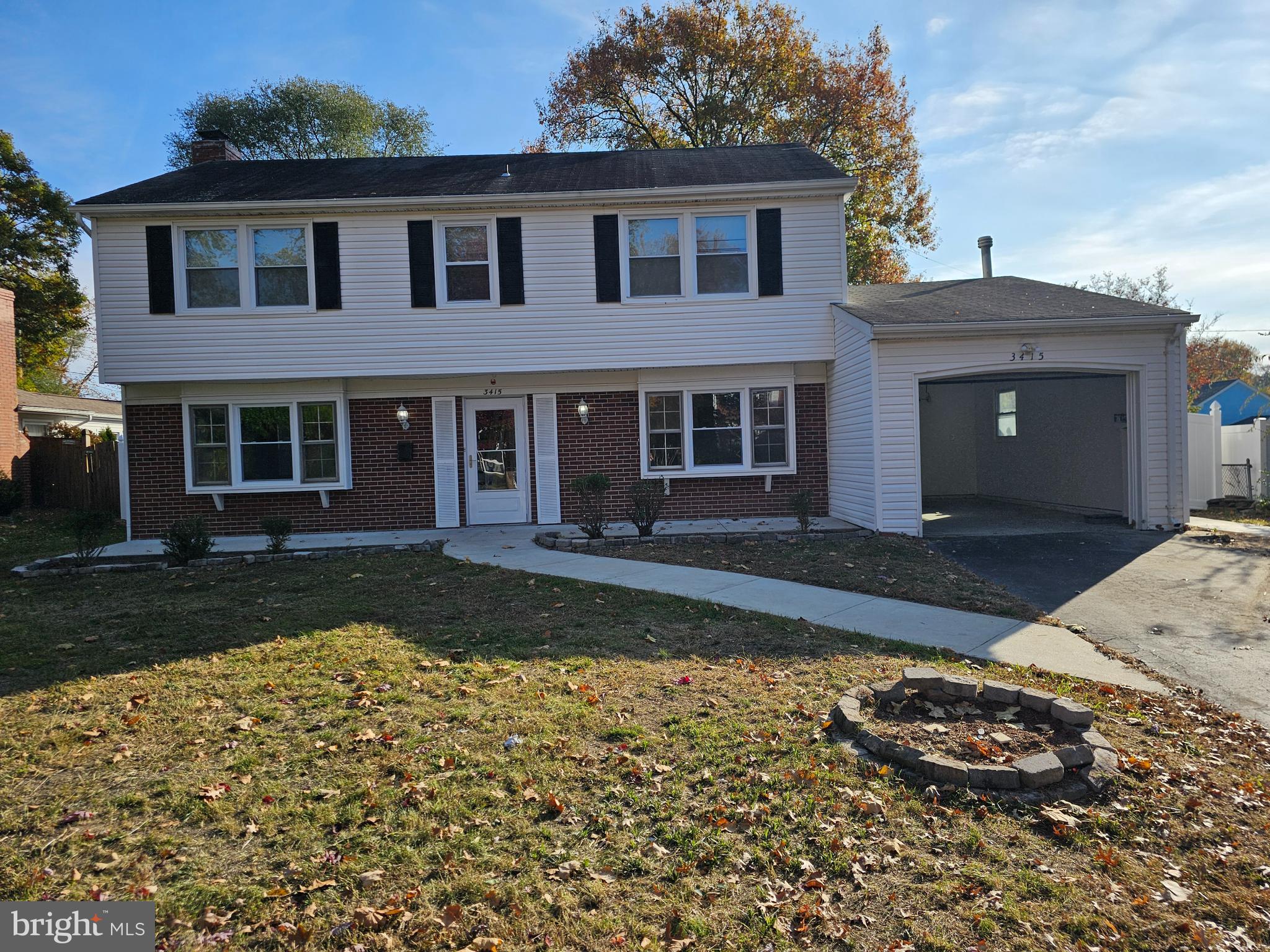 front view of a house with a yard