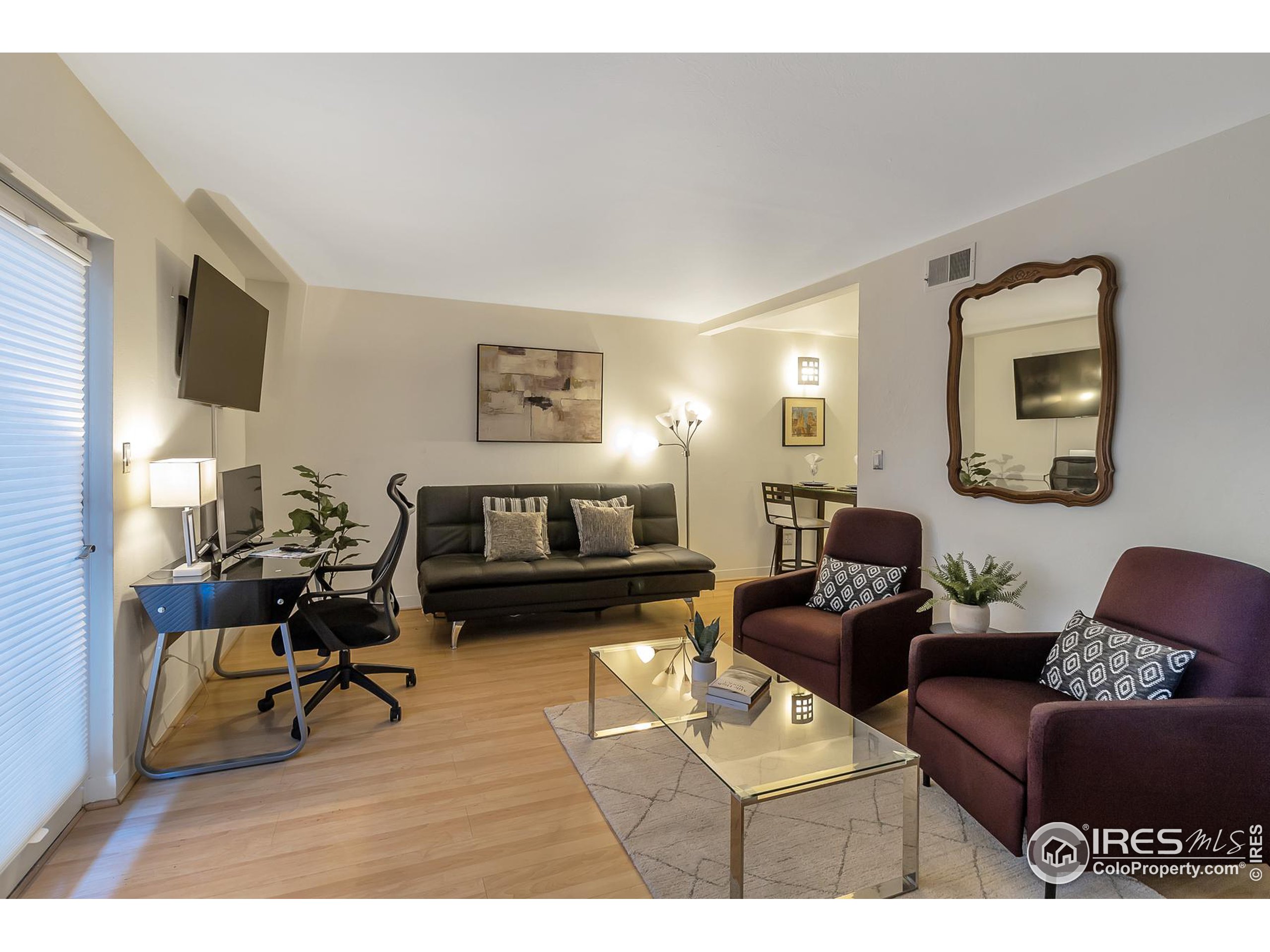 a living room with furniture or couch and a flat screen tv