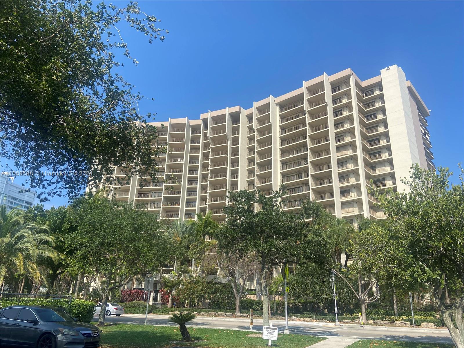 a view of a building with a yard