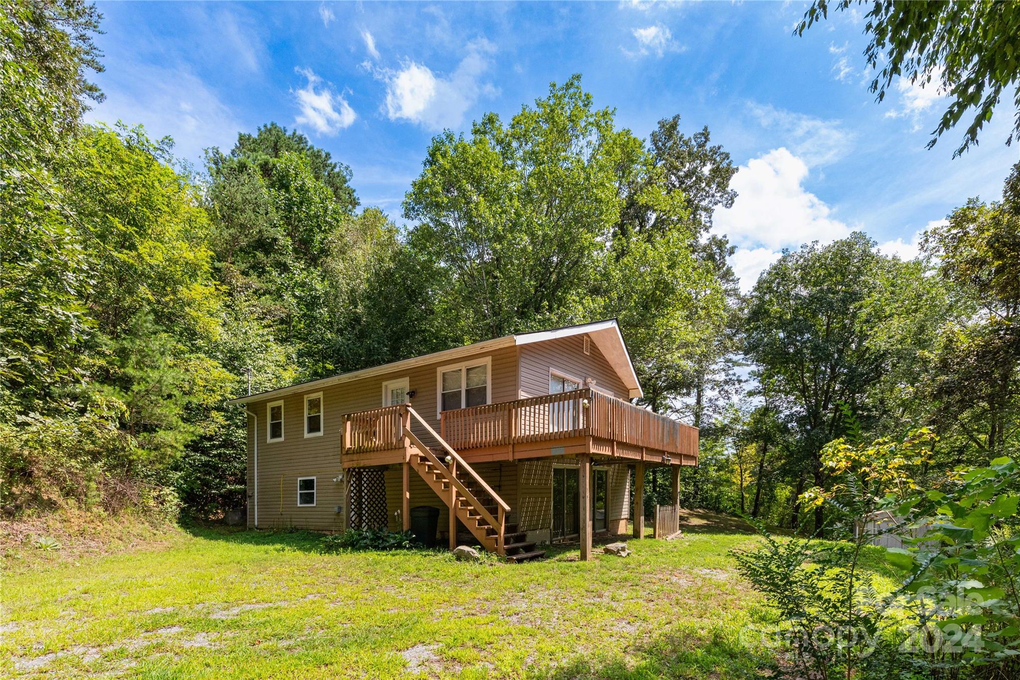 a house with trees in the background