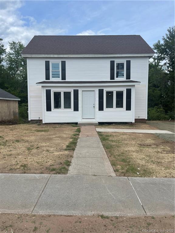 a front view of a house with yard