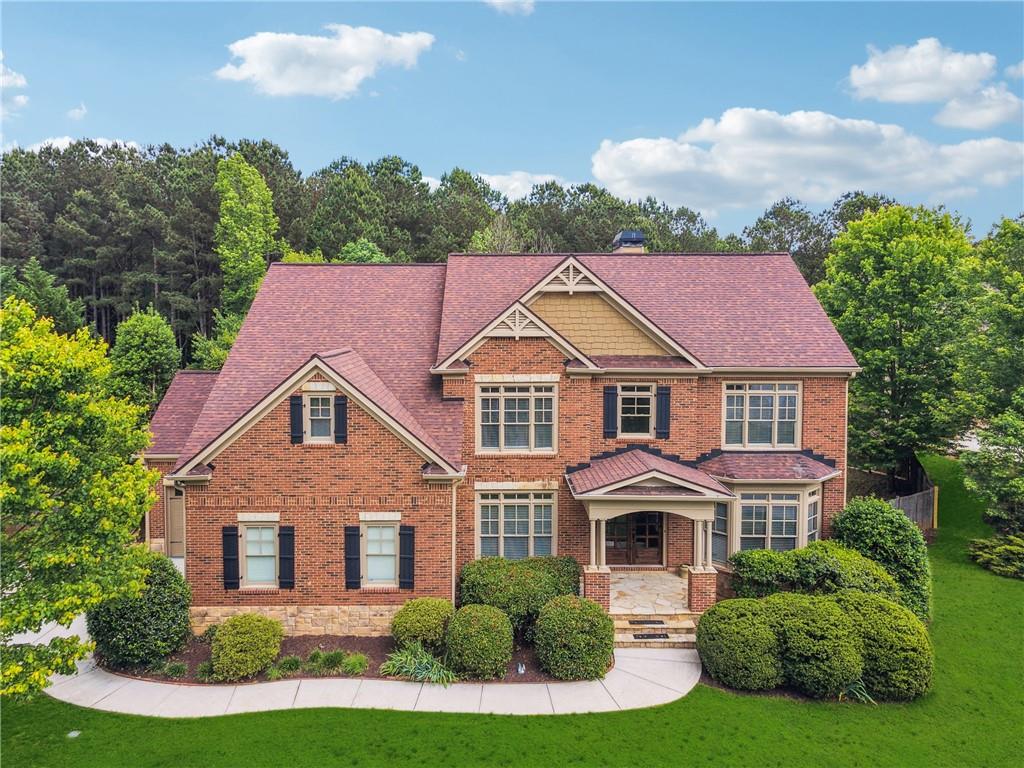 front view of a house with a yard