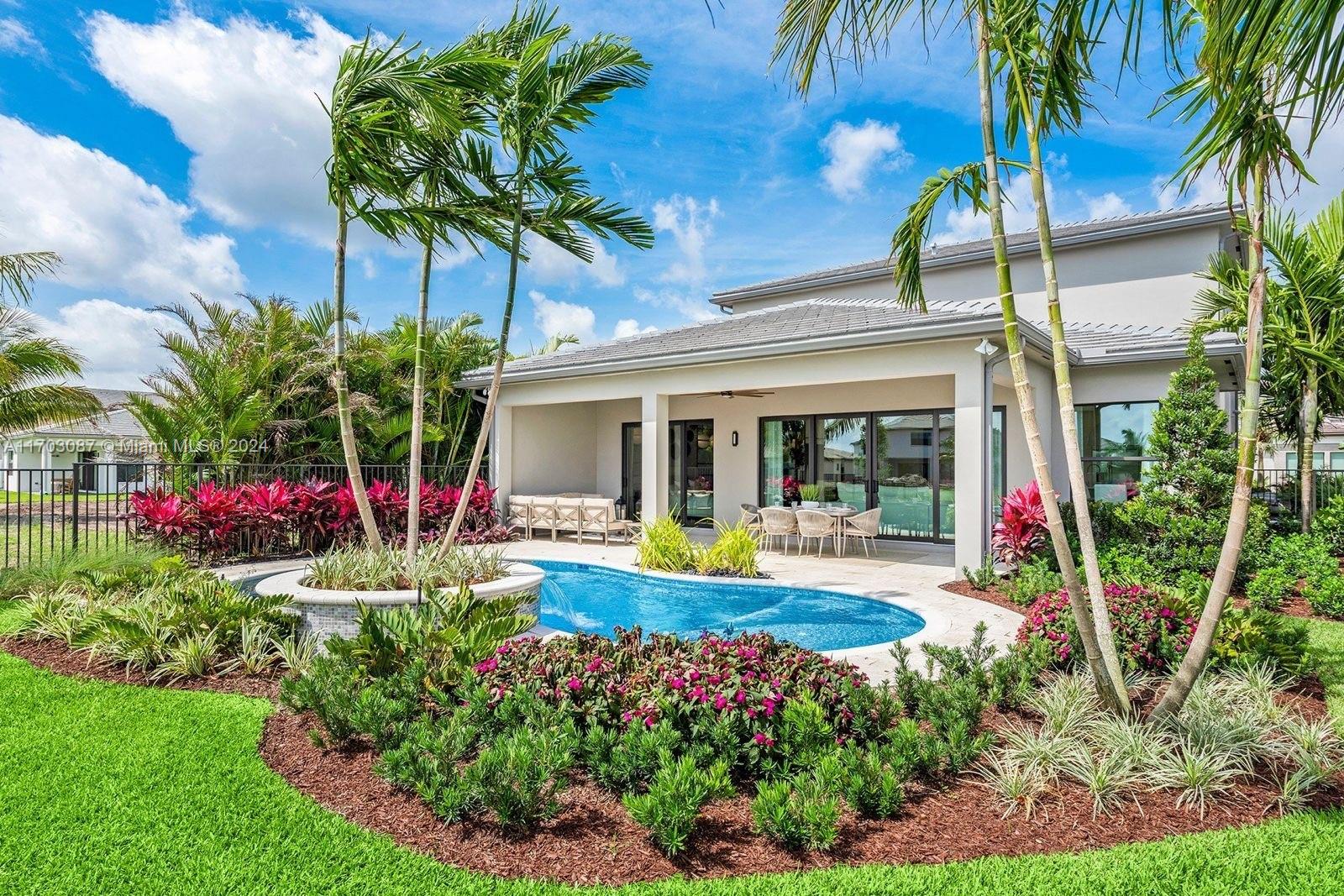 a view of a house with a backyard and garden