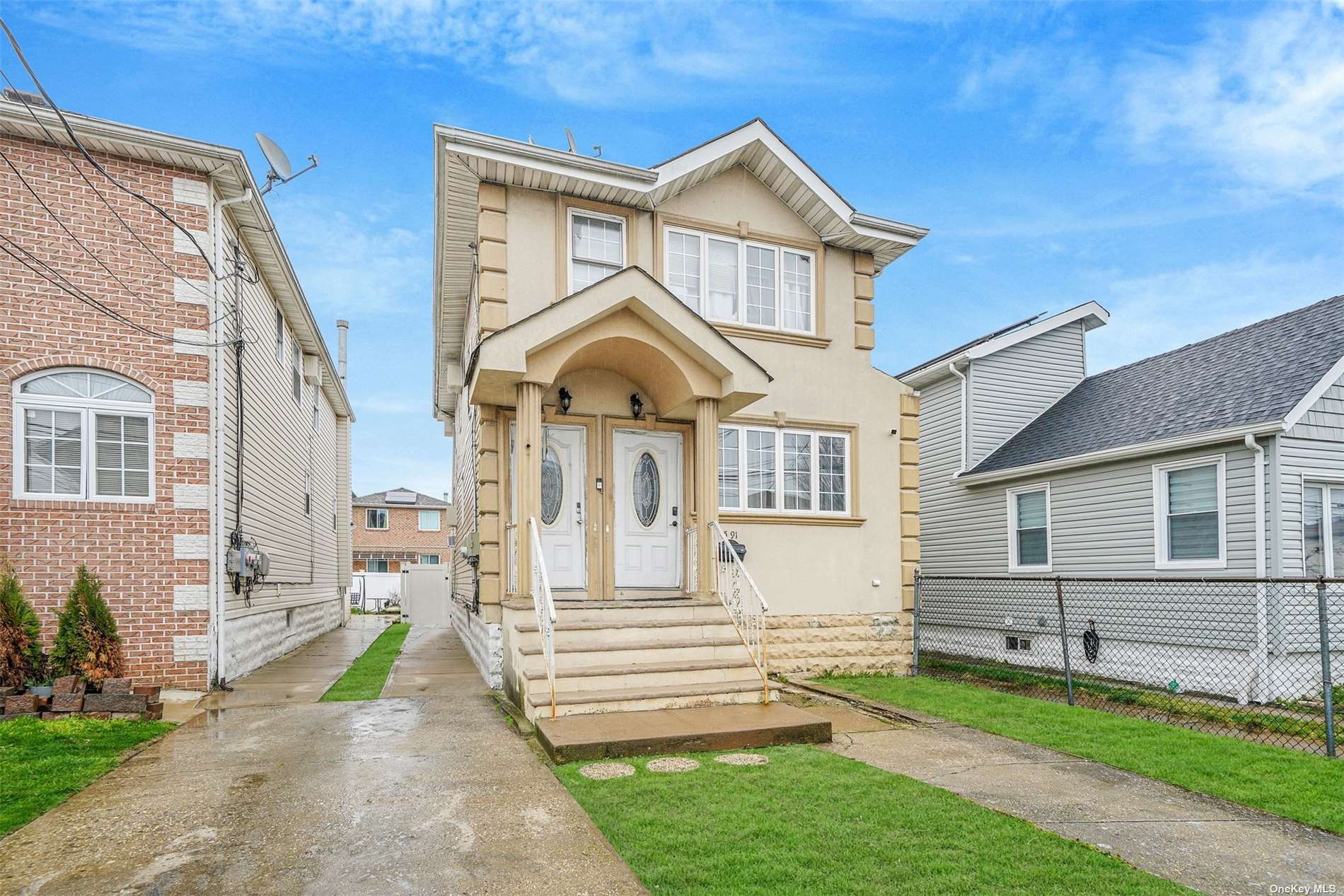 a front view of a house with a yard