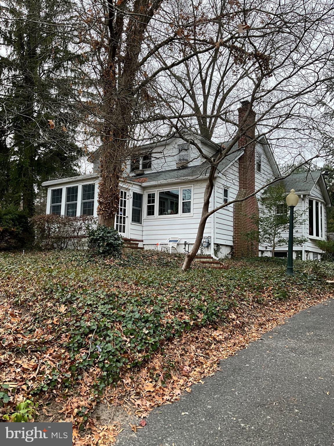 a house that has a tree in front of the house