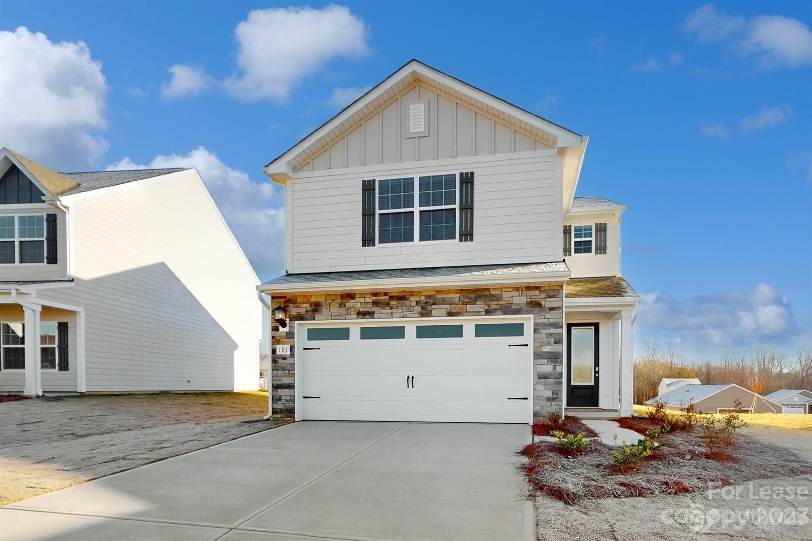 a front view of a house with a garage