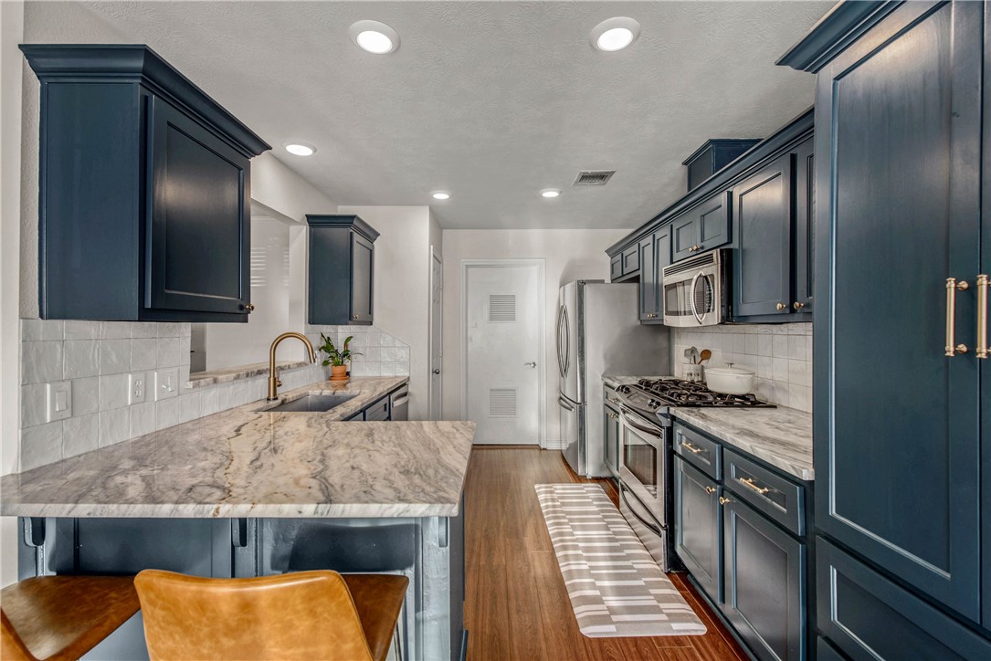 Kitchen featuring sink, tasteful backsplash, a kit