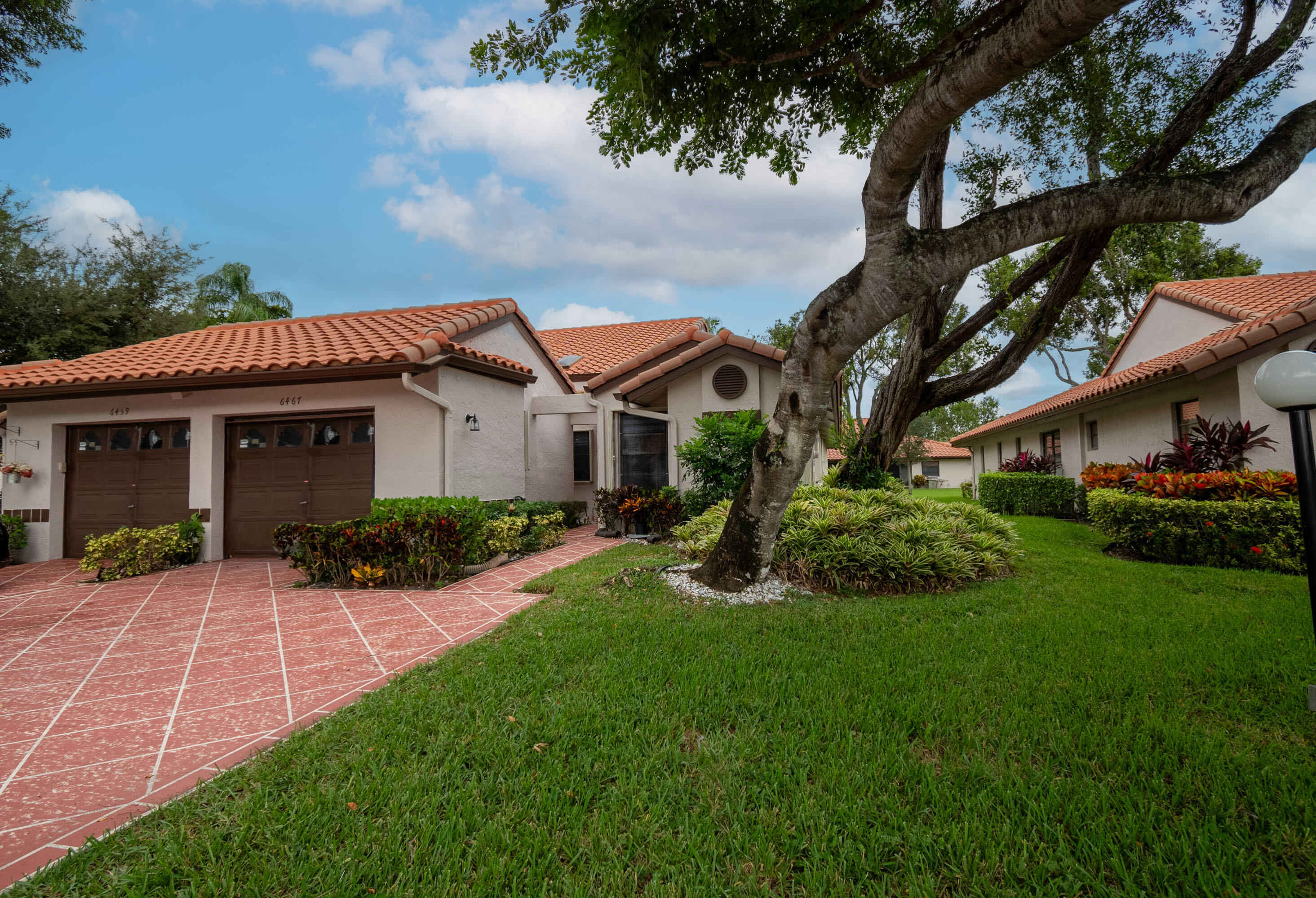 a front view of a house with a yard and porch