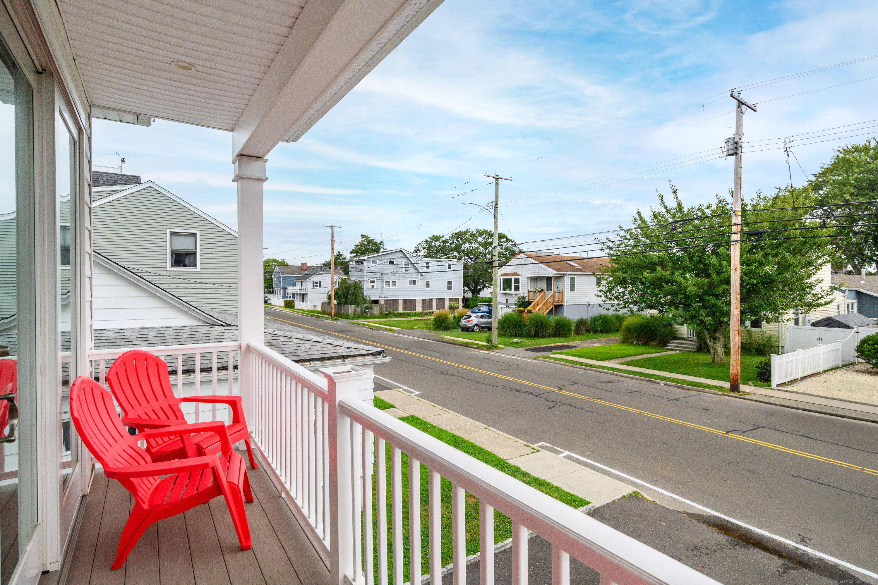 a view of a street with sitting area