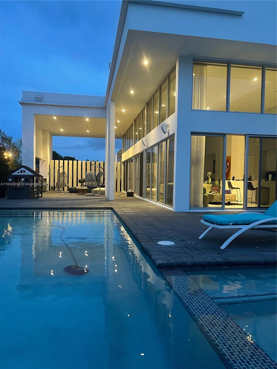 a view of swimming pool and outdoor seating