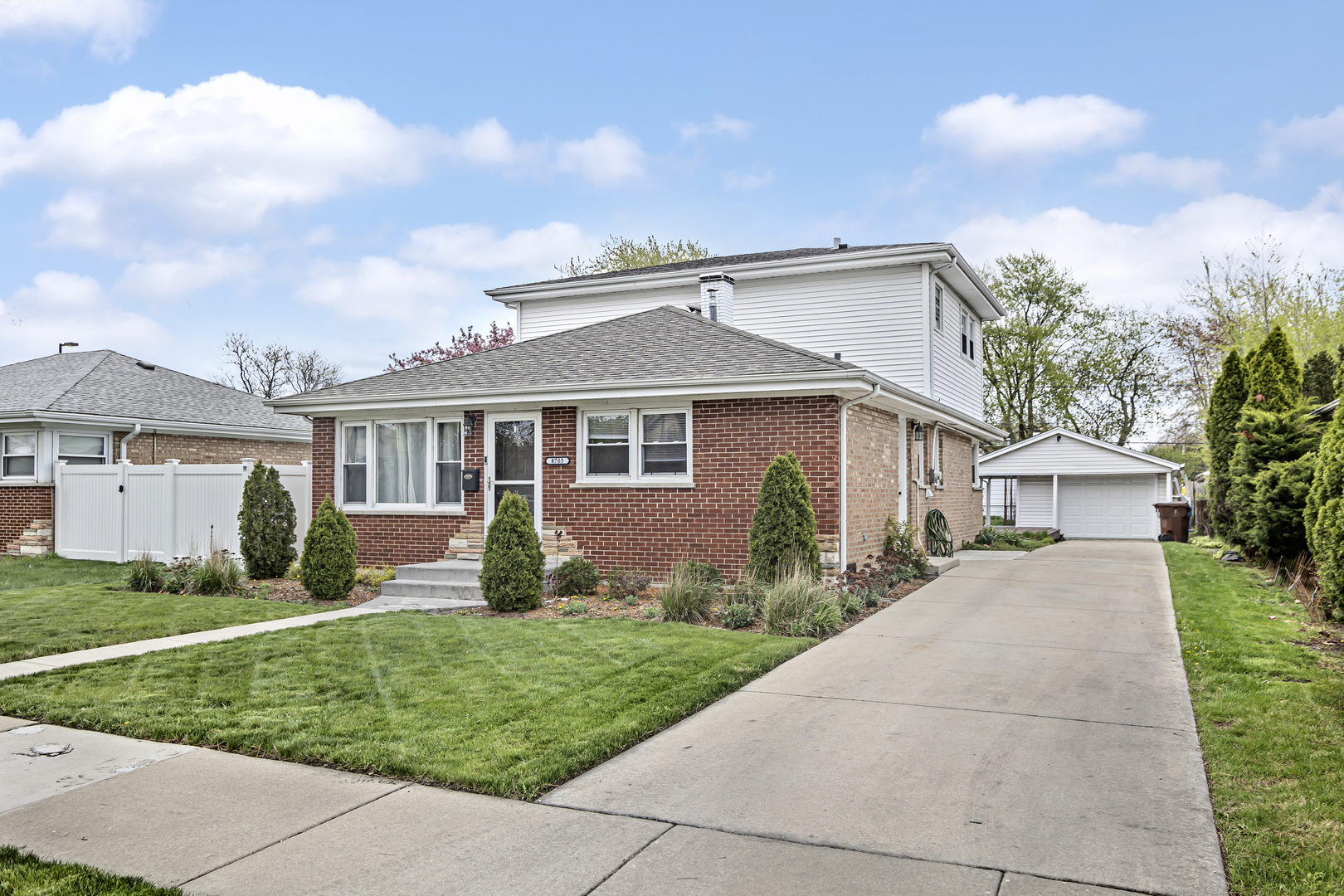 front view of a house with a yard