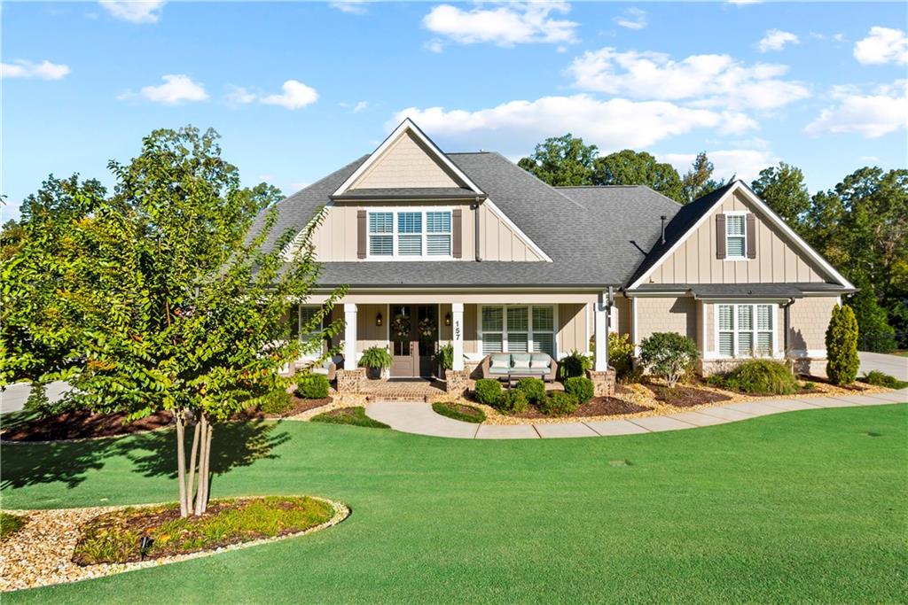 a front view of a house with a yard