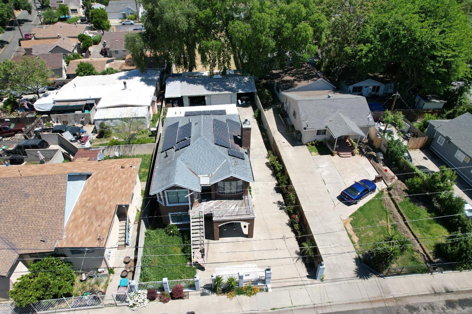 an aerial view of residential houses with outdoor space