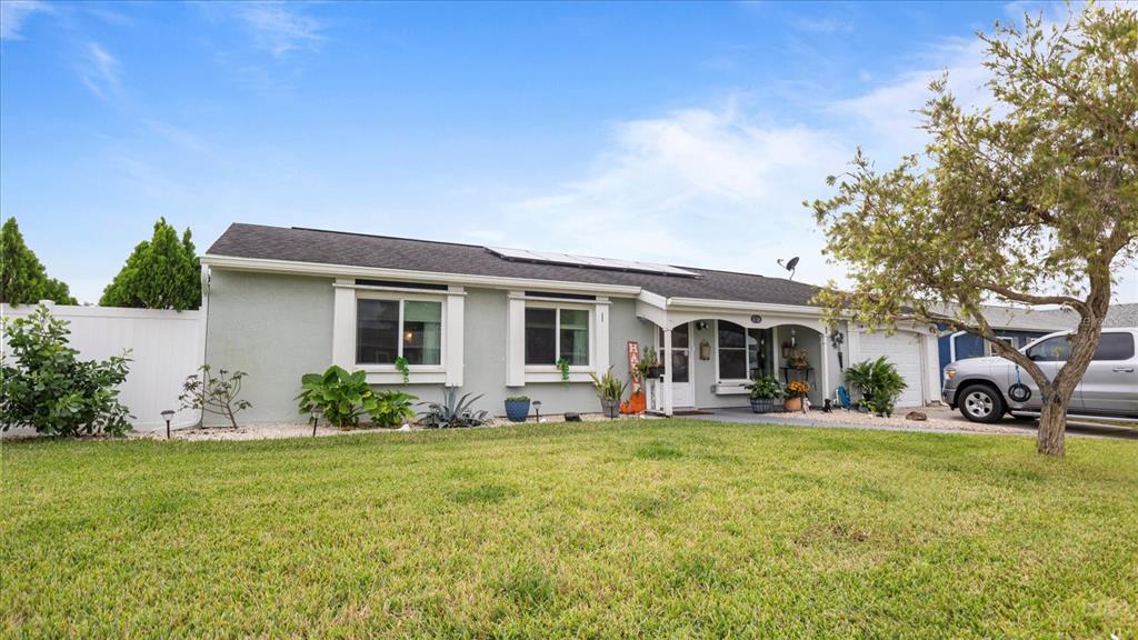 a front view of house with yard having outdoor seating